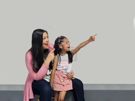 Photo for Divorced single mom with her 5 year old brunette Latina daughter spending quality time, happy, excited and surprised - Royalty Free Image