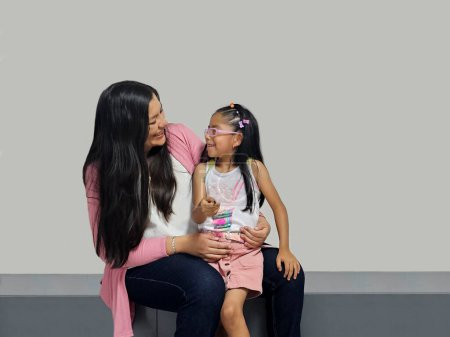 Photo for Divorced single mom with her 5 year old brunette Latina daughter spending quality time, happy, excited and surprised - Royalty Free Image