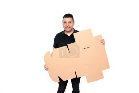 Latino adult man assembles a cardboard box following the instructions to achieve it