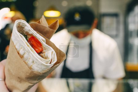 Photo for Woman holding a kebab with meat and vegetables - Royalty Free Image