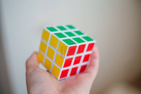 Photo for Female hands holding a rubik cube - Royalty Free Image