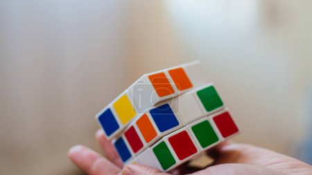 Photo for Female hands holding a rubik cube - Royalty Free Image