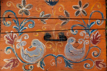 Photo for Old wooden Ukrainian chest for things and textile. Carpathian chest. - Royalty Free Image