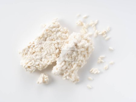 Photo for Rice malt placed against a white background. Koji mold. Koji is fermented rice. A view from directly above. - Royalty Free Image