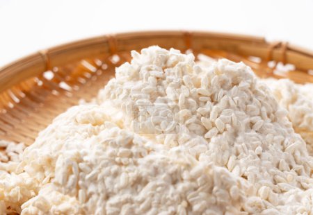 Photo for Rice malt placed against a white background. Koji mold. Koji is fermented rice. - Royalty Free Image
