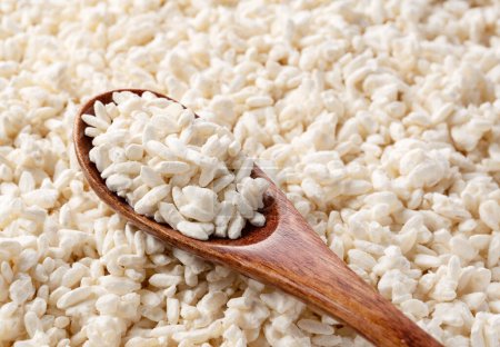 Foto de Close-up of rice koji and wooden spoon. Koji. Koji is fermented rice. - Imagen libre de derechos