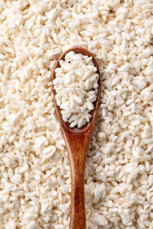 Photo for Close-up of rice koji and wooden spoon. Koji. Koji is fermented rice. A view from directly above. - Royalty Free Image