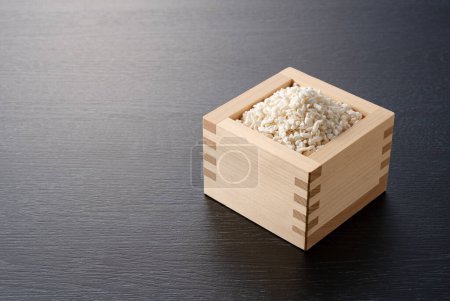 Foto de Rice koji in a box set against a black background. Koji. Koji is fermented rice. - Imagen libre de derechos