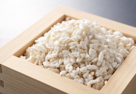 Photo for Rice koji in a box set against a black background. Koji. Koji is fermented rice. - Royalty Free Image