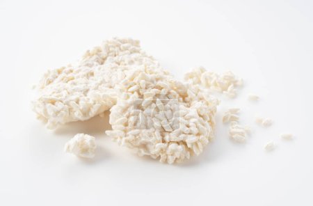 Téléchargez les photos : Rice malt placed against a white background. Koji mold. Koji is fermented rice. - en image libre de droit