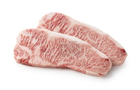 Fresh raw beef steaks set against a white background. Wagyu beef steak.