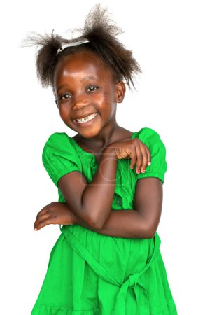 Téléchargez les photos : Close up studio portrait of cute little African girl in a green dress. Isolated on white background. - en image libre de droit