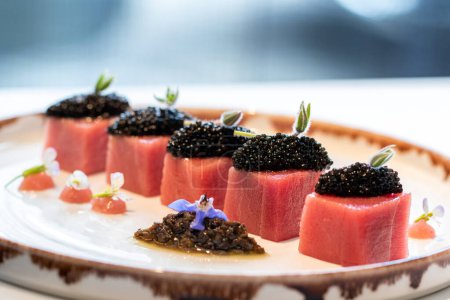 Photo for Macro close up detail of appetizing blue fin tuna sashimi with Beluga caviar - Royalty Free Image