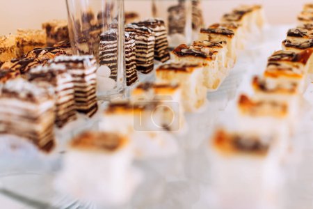 Photo for Candy bar and wedding with sweets, buffet with cupcakes and dessert. - Royalty Free Image