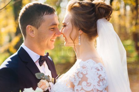 Photo for Profile of newlyweds smiling in the park. close up. - Royalty Free Image
