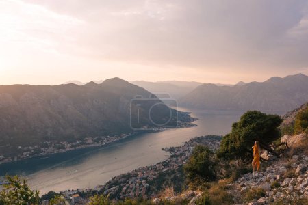 Photo for Woman tourist enjoying the view of Kotor. Montenegro. - Royalty Free Image