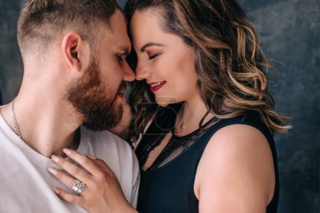 Foto de Happy couple in love embracing, husband and wife with closed eyes, horizontal banner, smiling family enjoying tender moment, sincere feelings - Imagen libre de derechos