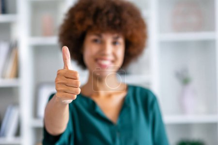 Photo for Young african american successful businesswoman showing thumb up. Occupation, ceo management. Well done! - Royalty Free Image