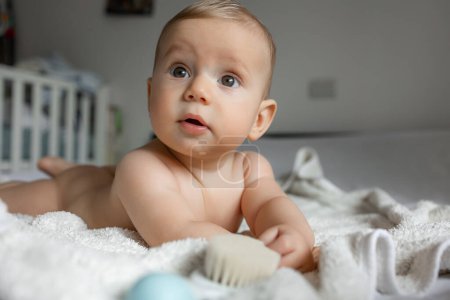 Photo for Baby lying on stomach on the bed. Tummy time concept. - Royalty Free Image