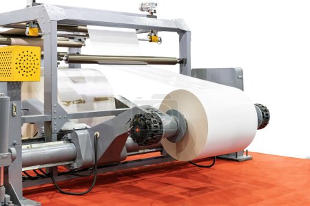 Photo for Close up electric motor and paper roll sheet system for converting or feed paper of high speed automatic roll slitting and rewinder machine in industrial isolated on white with clipping path - Royalty Free Image