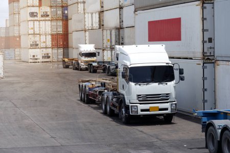 Trucks in the container depot in the import and export area at the port.
