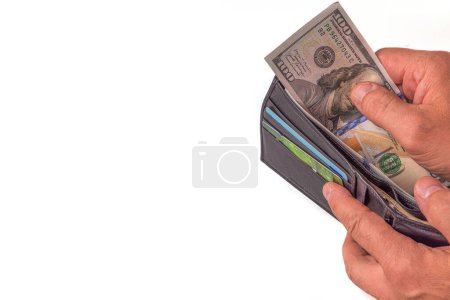 Photo for Close up view of wallet with dollar banknotes in man's hands. Sweden. - Royalty Free Image
