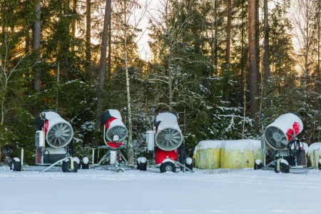 Foto de View of snow cannons to make artificial ski tracks. Sweden. Storvreta. 02.26.2023. - Imagen libre de derechos