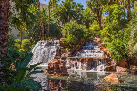 Gorgeous view of waterfall and tropical trees on background. Las Vegas. USA.