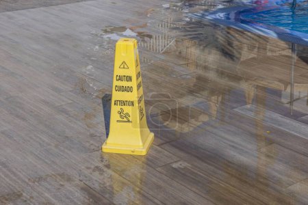Photo for Close-up view of yellow wet floor attention sign. Gran Canaria, Spain. - Royalty Free Image