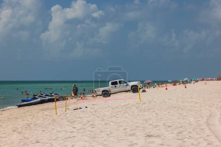 Photo for White Jeep parked to load water scooters into back on Miami Beach on coast Atlantic Ocean. USA. Miami Beach. - Royalty Free Image