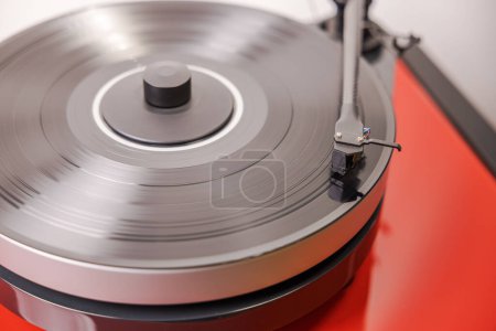 Photo for Close-up view of vinyl record player with spinning vinyl record, capturing essence of analog music. - Royalty Free Image