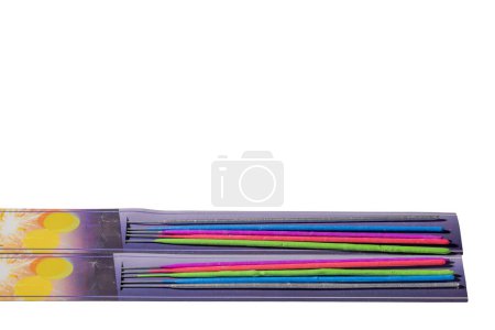 Photo for A close-up view of packaging with colorful sparklers against an isolated white background. - Royalty Free Image