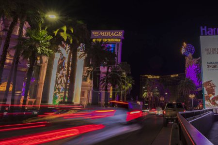 Photo for Beautiful night view of Las Vegas, with blurred car lights tracing along the Strip road. Las Vegas. USA. - Royalty Free Image