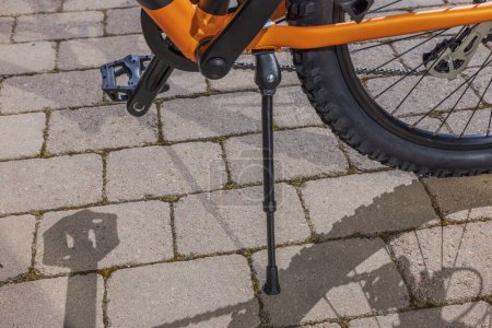 Close-up view of bicycle standing on path with help of bicycle stand. Sweden.