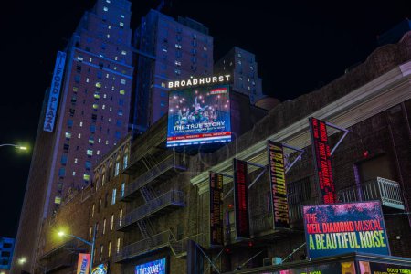 Photo for Night view of the facade of the Broadhurst Theatre with billboards advertising the musical "The Neil Diamond Musical: A Beautiful Noise. NY. USA. - Royalty Free Image