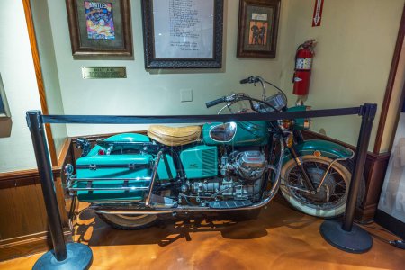 Photo for The iconic Moto Guzzi motorcycle, once owned by John Lennon and featured in the film 'How I Won the War, is displayed at the Hard Rock Cafe on Broadway in Manhattan. NY. USA. - Royalty Free Image