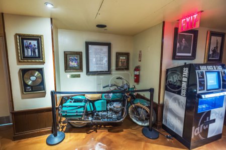 Photo for Iconic Moto Guzzi motorcycle, once owned by John Lennon is displayed at the Hard Rock Cafe on Broadway in Manhattan. New York. USA. - Royalty Free Image