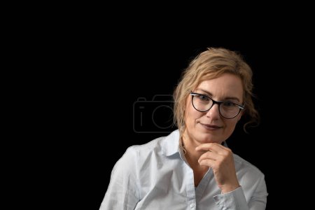 Portrait of  beautiful adult woman supporting her chin. Horizontally. 