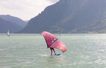 Photo for Wingsurfer on an Italian lake, selective focus - Royalty Free Image