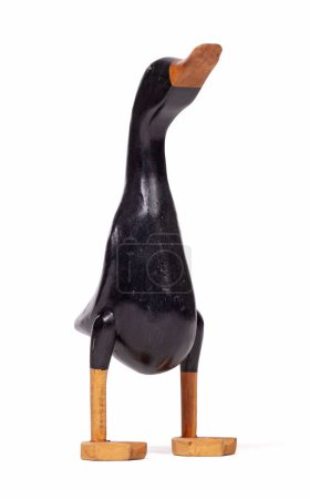 Foto de Divertido pato negro de madera sobre un fondo blanco - Imagen libre de derechos