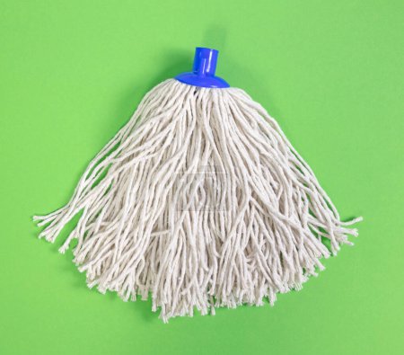 Simple new mop isolated on a green background