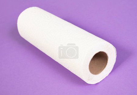 White kitchen paper isolated on a purple background