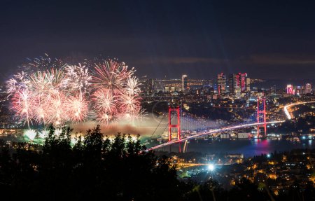 Photo for Fireworks over Istanbul Bosphorus during Turkish Republic Day celebrations. Fireworks with 15th July Martyrs Bridge (Bosphorus Bridge). Istanbul, Turkey. - Royalty Free Image