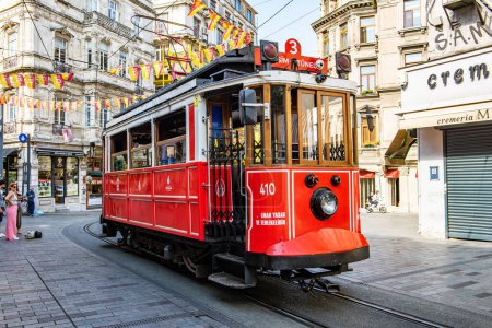 Photo for Istanbul, Turkey - August 21, 2023: Nostalgic Red Tram of Istanbul. Historic tram in Taksim Istiklal Street. Touristic popular destination Taksim Istiklal Street. Beyoglu, Istanbul, Turkey. - Royalty Free Image