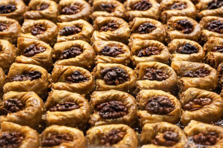 Photo for Turkish sweet baklava on tray. Traditional Baklava from Gaziantep, Turkey. Baklava with walnut. - Royalty Free Image
