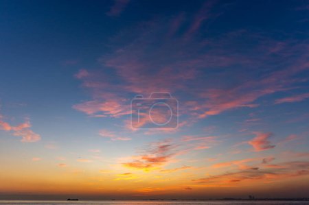 Photo for Sunset sky. Beautiful cloudy sunset sunrise sky. Orange and blue colors. Fiery orange sunset sky. - Royalty Free Image