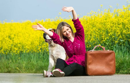 Photo for Girl with a dog hitchhike - Royalty Free Image