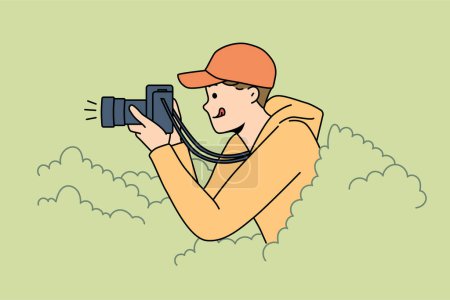 Illustration for Smiling young man hide in bushes make pictures with professional camera. Happy guy journalist or reporter take photos from hidden spot. Vector illustration. - Royalty Free Image