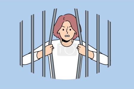 Woman prisoner breaks bars wanting to be released from captivity, for concept fight against discrimination and restrictions. Girl prisoner trying to escape from prison to avoid punishment for crimes
