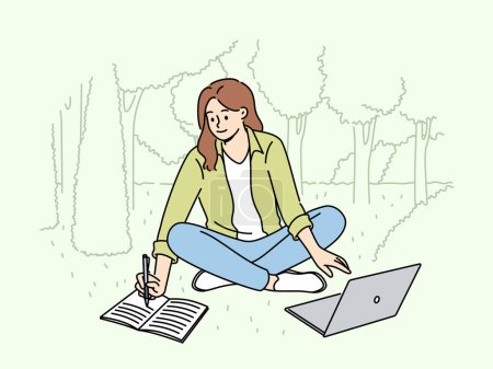 Woman student is sitting on lawn making notes in notebook and using laptop enjoying working in park. Happy girl student watching educational video and writing notes located in park